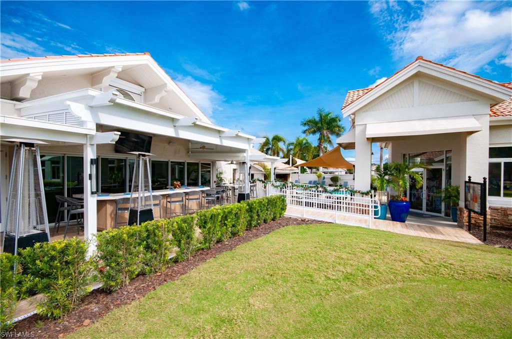 10020 Heather Lane, Unit 901 Naples, FL 34119 - Photo 34 of 34 a view of a house with sitting area and garden