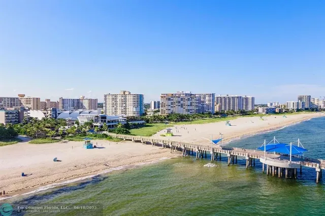 a bathroom with a sink a mirror and a shower