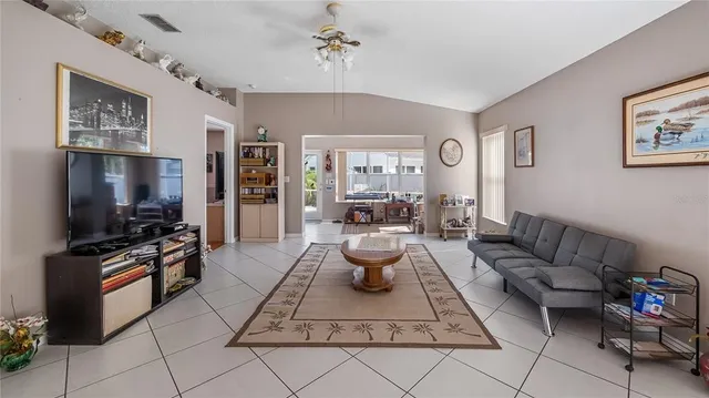 a view of a hallway with dining area