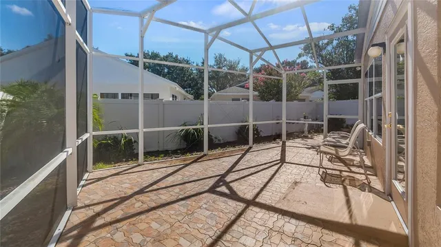 a view of backyard path with potted plants
