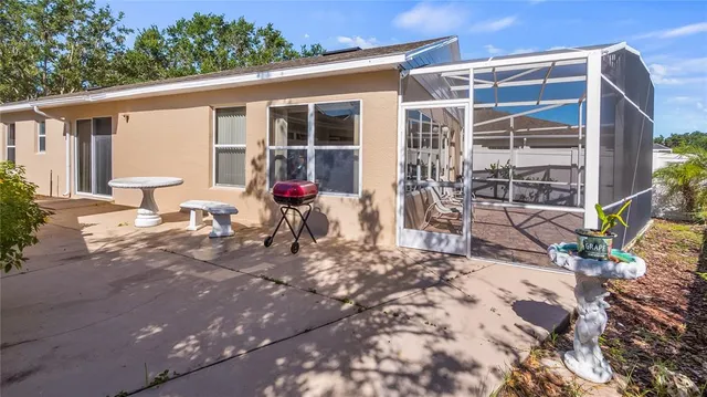 a backyard of a house with outdoor seating