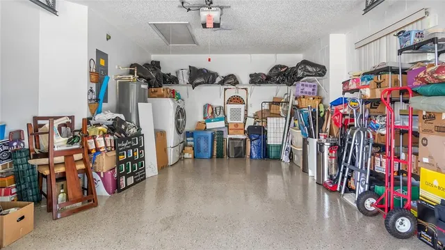 an aerial view of residential houses with outdoor space and swimming pool