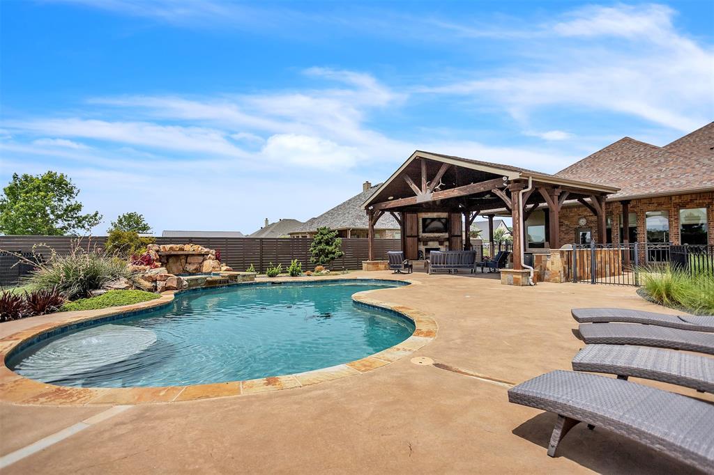 12286 Emerald Ranch Lane North Forney, TX 75126 - Photo 36 of 40 a view of a house with swimming pool and sitting area