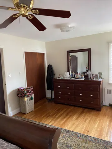 a room with a dresser and a mirror
