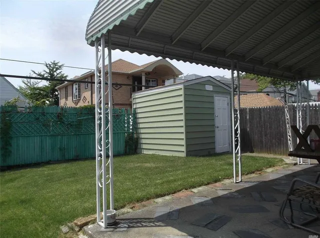 a house view with a backyard space