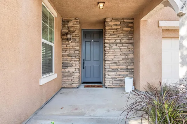 a view of front door of house and stairs