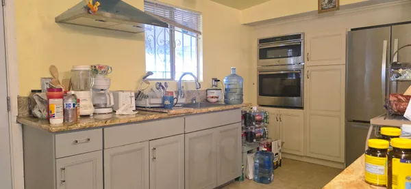 a bedroom with a bed and a mirror