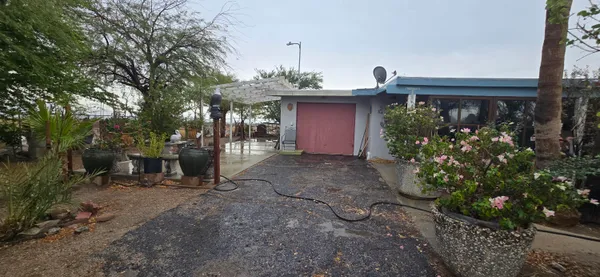 a living room with furniture and a mirror