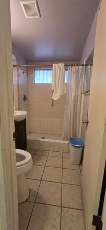 a view of backyard with sitting area