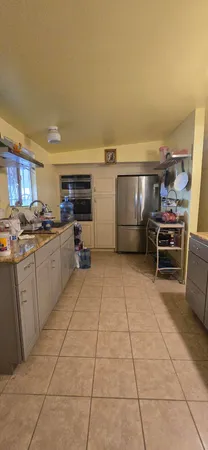 a kitchen with sink and cabinets