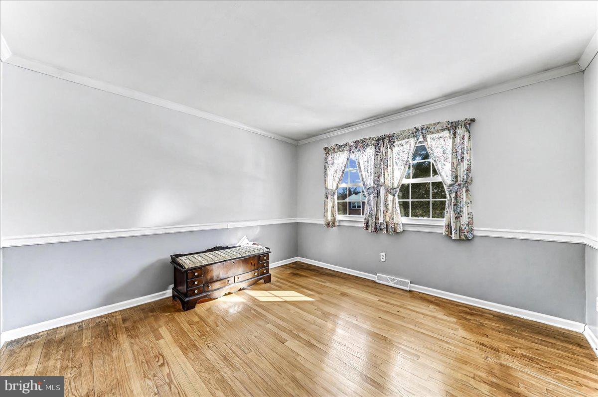 123 Reybold Drive Delaware City, DE 19706 - Photo 19 of 30 an empty room with windows