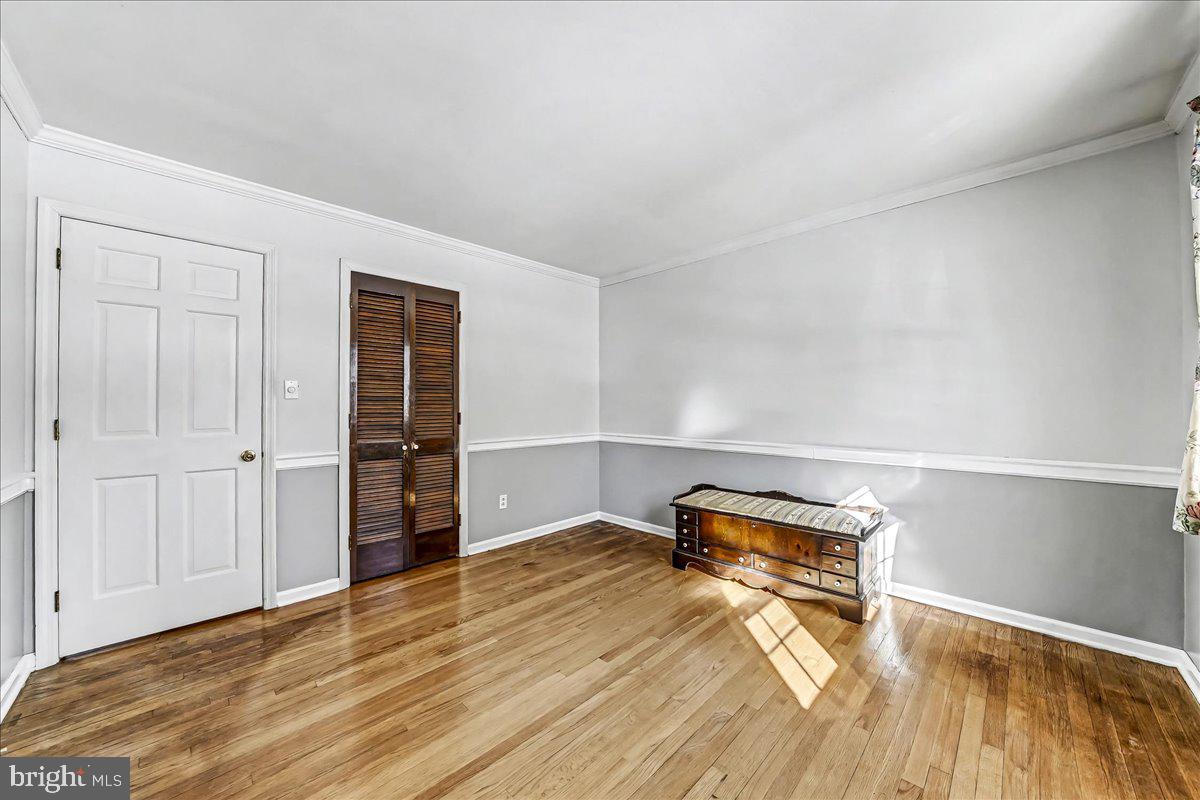 123 Reybold Drive Delaware City, DE 19706 - Photo 20 of 30 a view of empty room with wooden floor