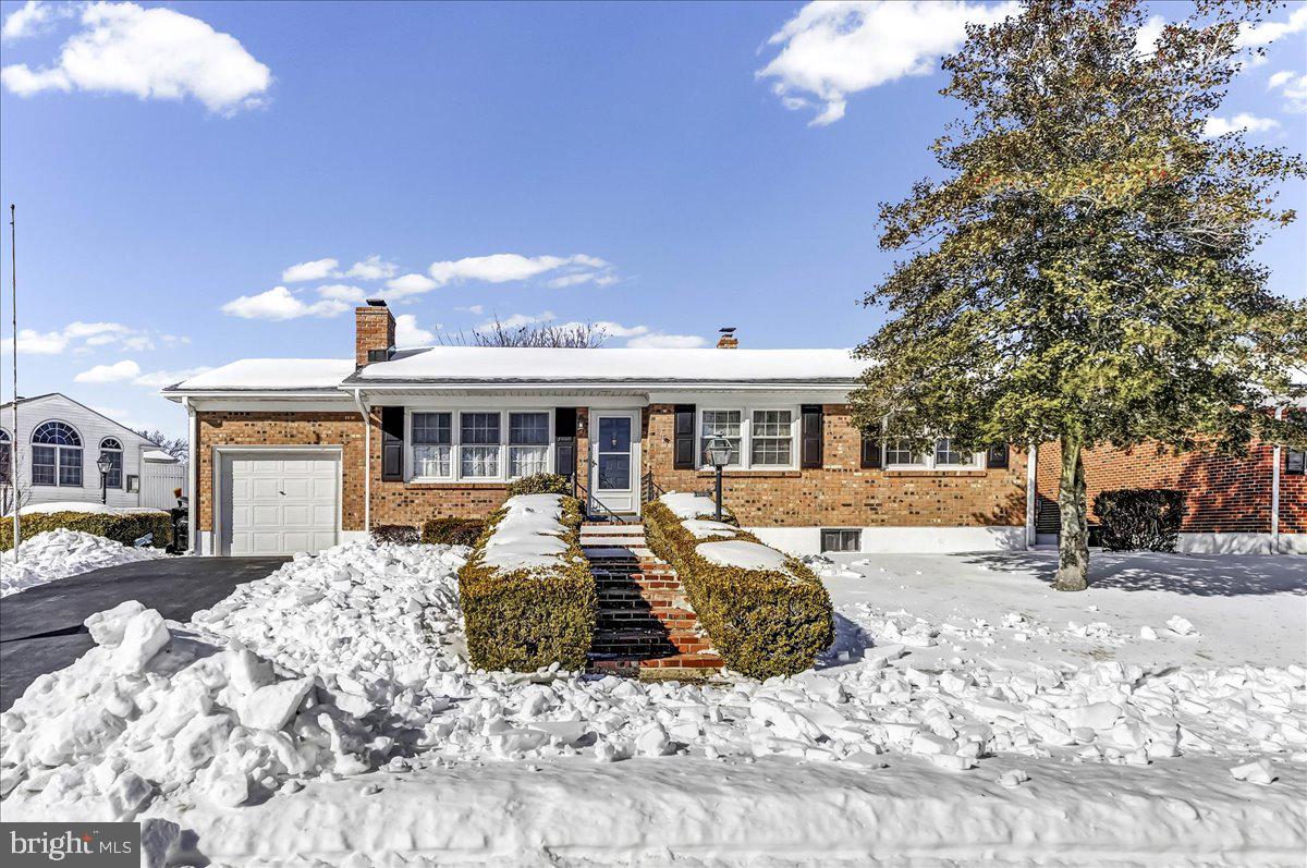 123 Reybold Drive Delaware City, DE 19706 - Photo 2 of 30 a front view of a house with a yard outdoor seating and barbeque oven