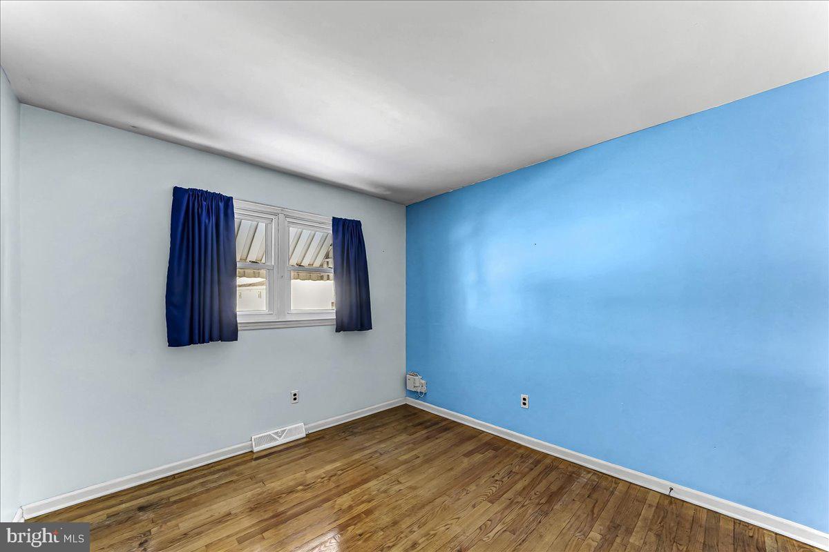 123 Reybold Drive Delaware City, DE 19706 - Photo 21 of 30 an empty room with windows