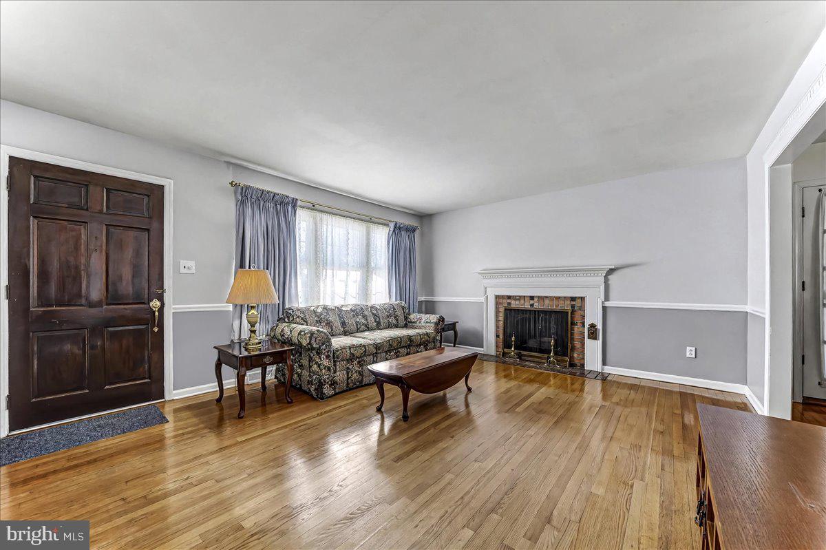 123 Reybold Drive Delaware City, DE 19706 - Photo 3 of 30 a living room with furniture and a fireplace