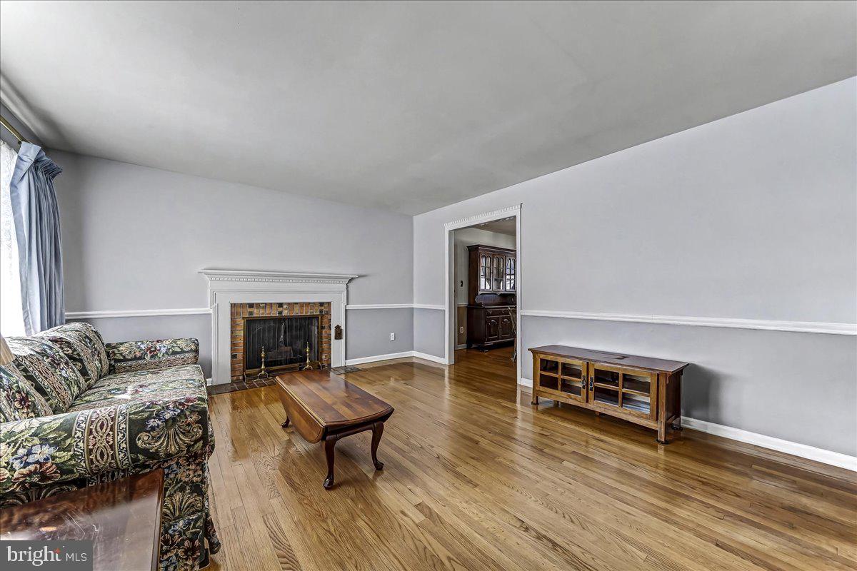 123 Reybold Drive Delaware City, DE 19706 - Photo 5 of 30 a living room with furniture and a fireplace