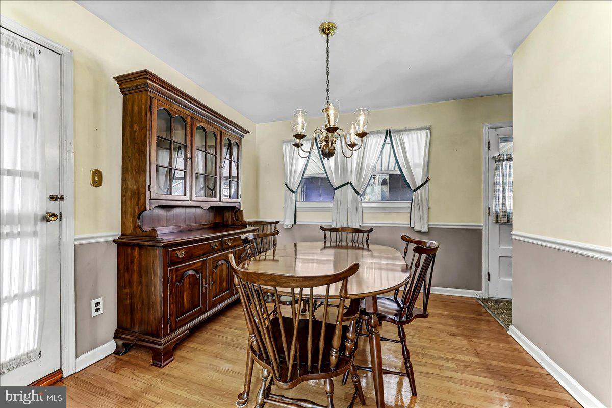 123 Reybold Drive Delaware City, DE 19706 - Photo 7 of 30 a view of a dining room with furniture window and wooden floor