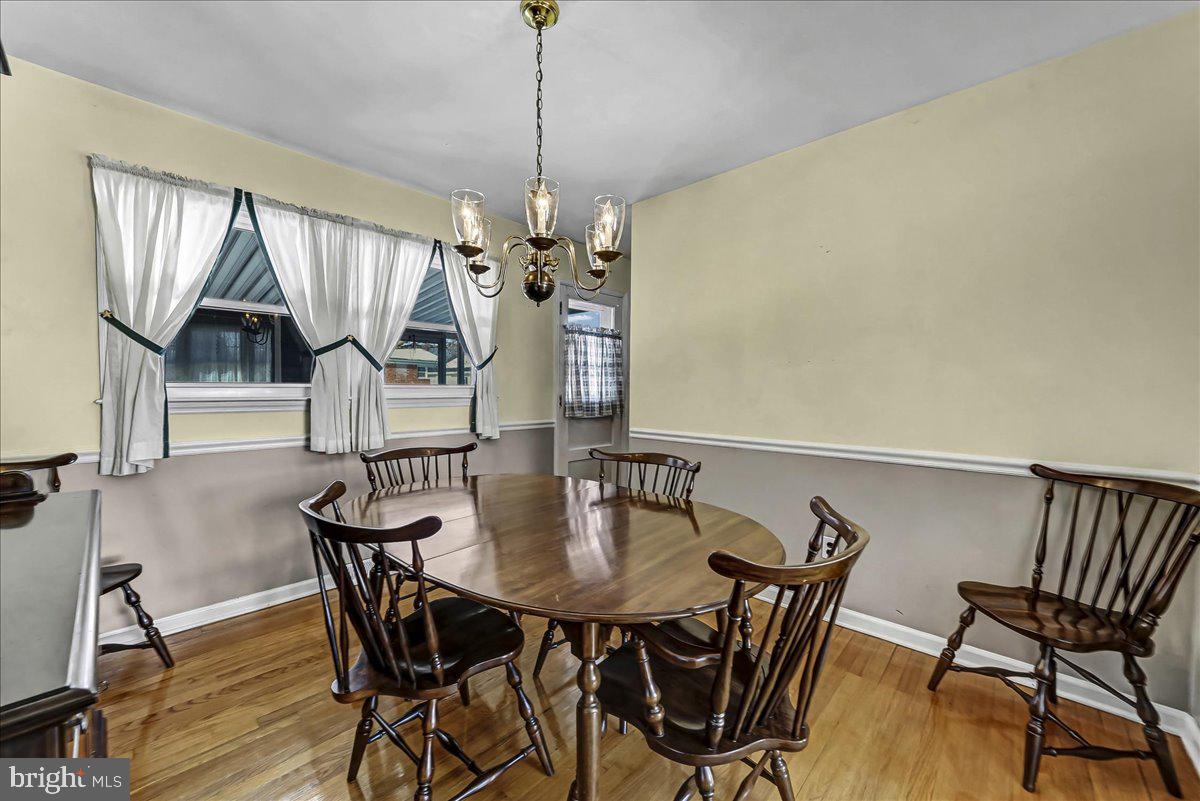 123 Reybold Drive Delaware City, DE 19706 - Photo 8 of 30 a view of a dining room with furniture and wooden floor