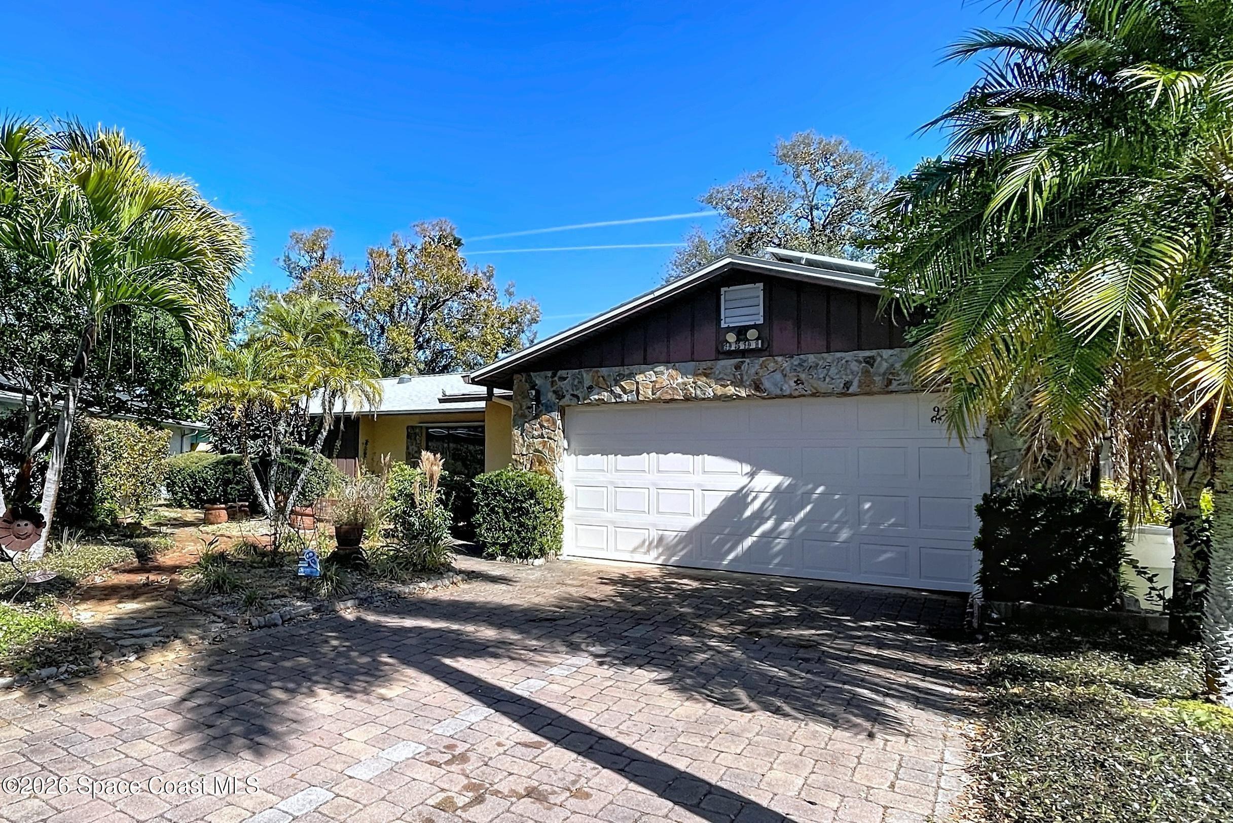 9591 128th Terrace North Largo, FL 33773 - Photo 11 of 90 a front view of a house with garden