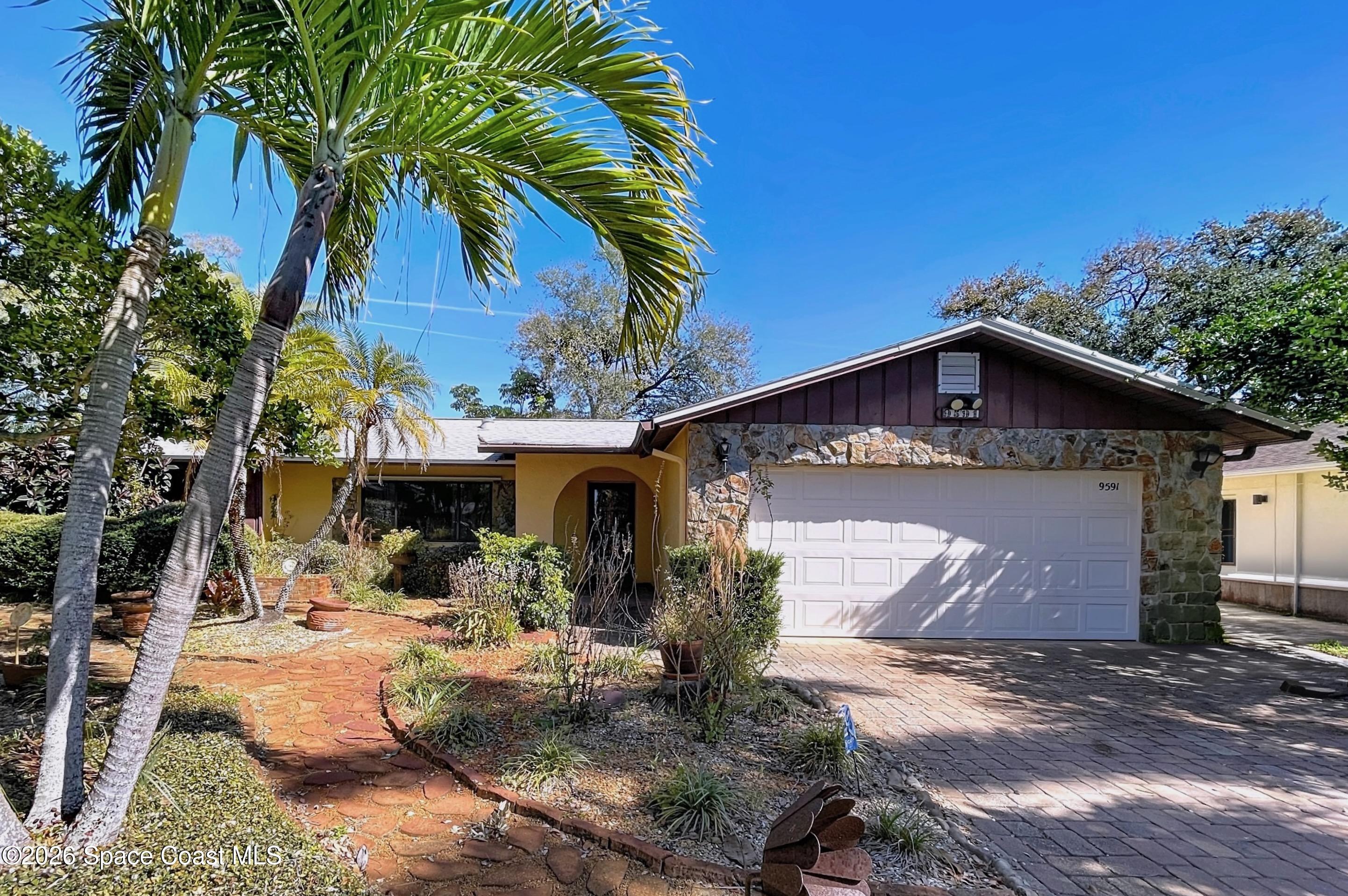 9591 128th Terrace North Largo, FL 33773 - Photo 17 of 90 a view of a entrance gate of the house