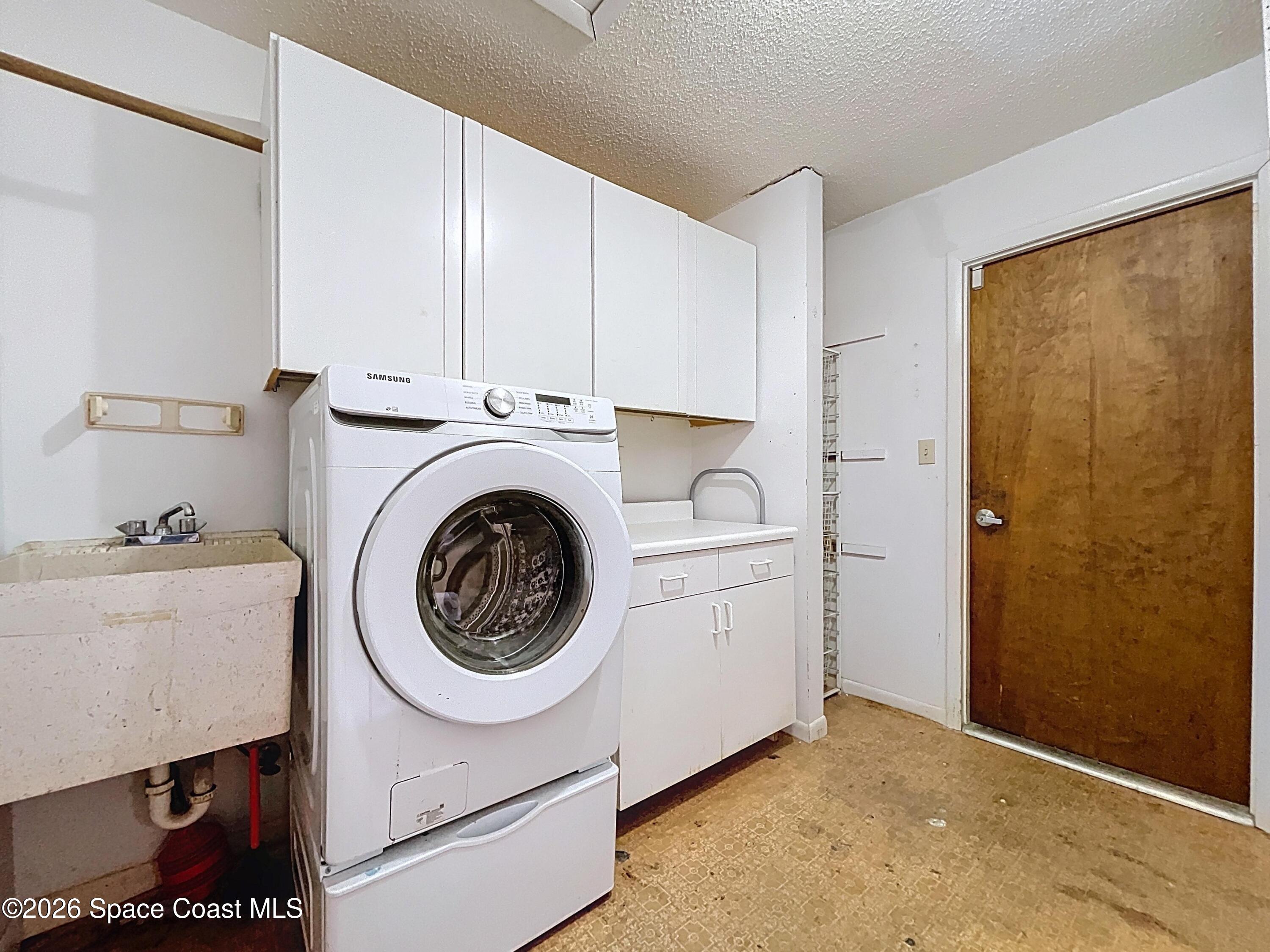 9591 128th Terrace North Largo, FL 33773 - Photo 52 of 90 a utility room with dryer and washer