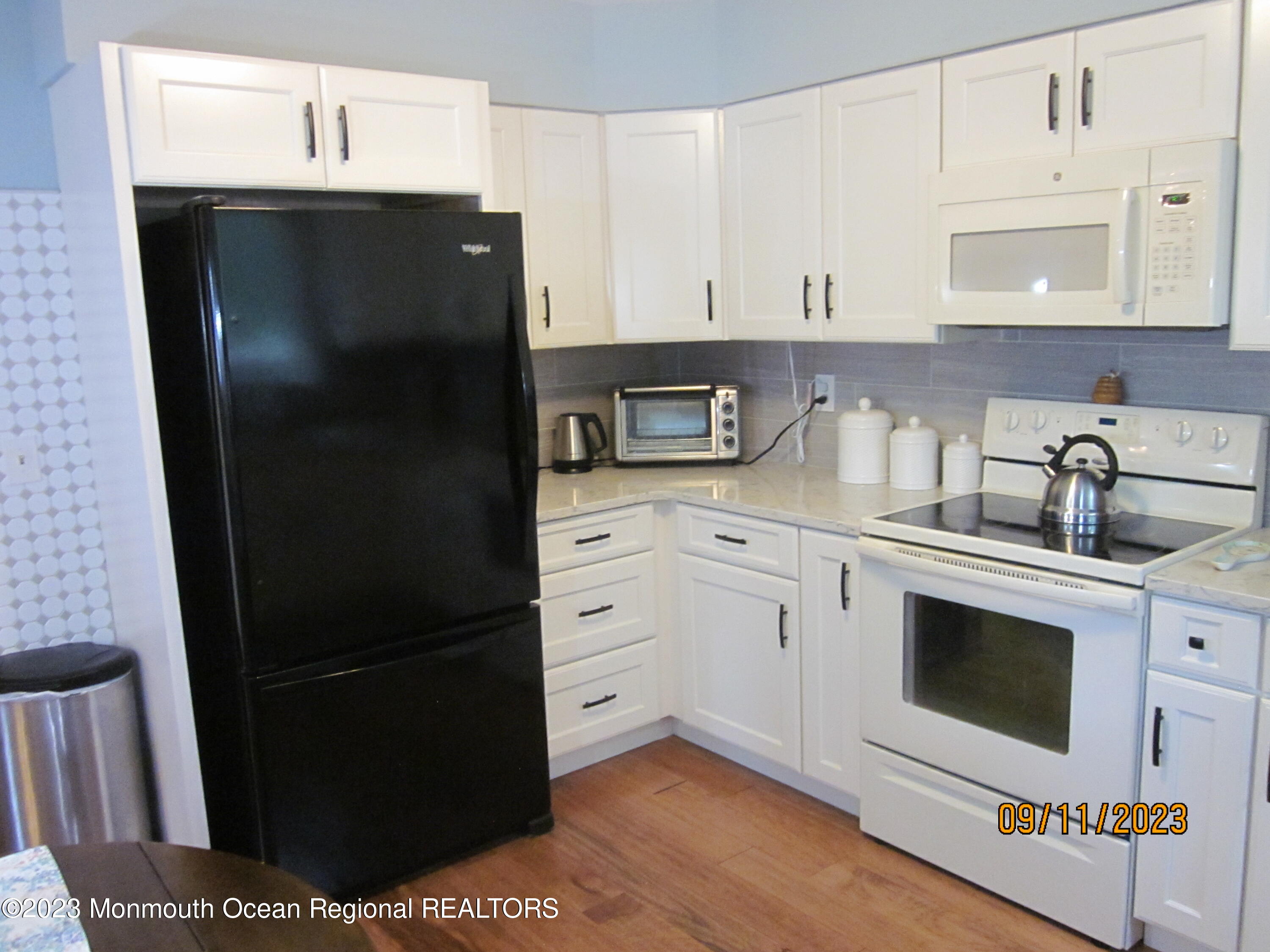 53 B Berkshire Road Whiting, NJ 08759 - Photo 14 of 37 a kitchen with a refrigerator and cabinets