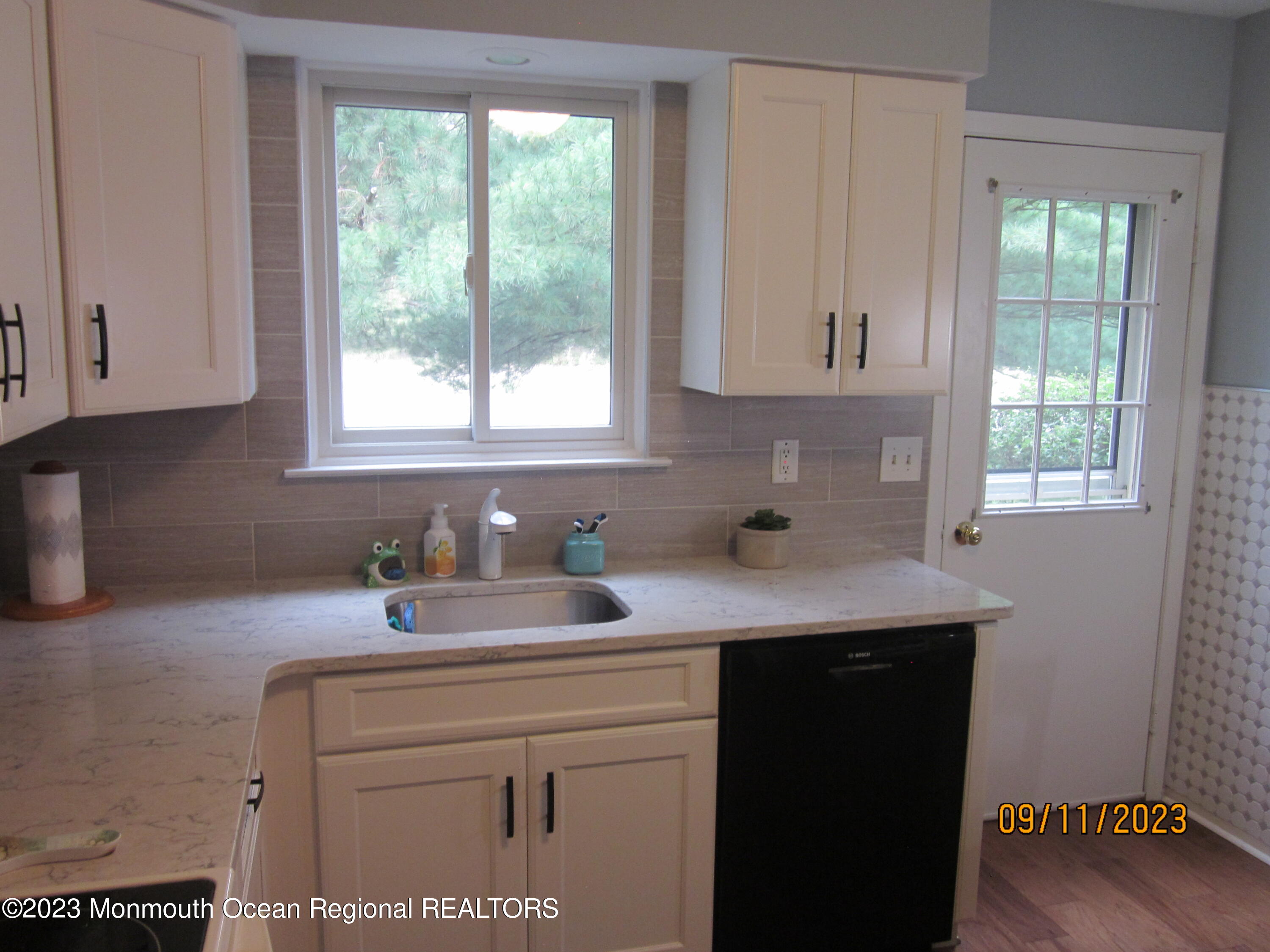 53 B Berkshire Road Whiting, NJ 08759 - Photo 15 of 37 a kitchen with a sink cabinets and window