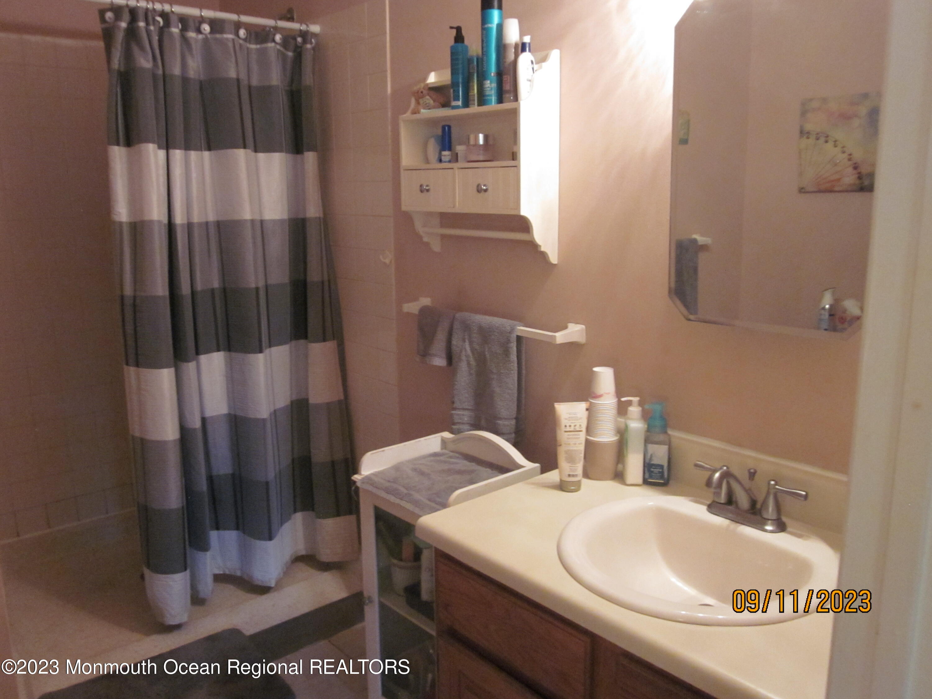 53 B Berkshire Road Whiting, NJ 08759 - Photo 24 of 37 a bathroom with a sink and a mirror