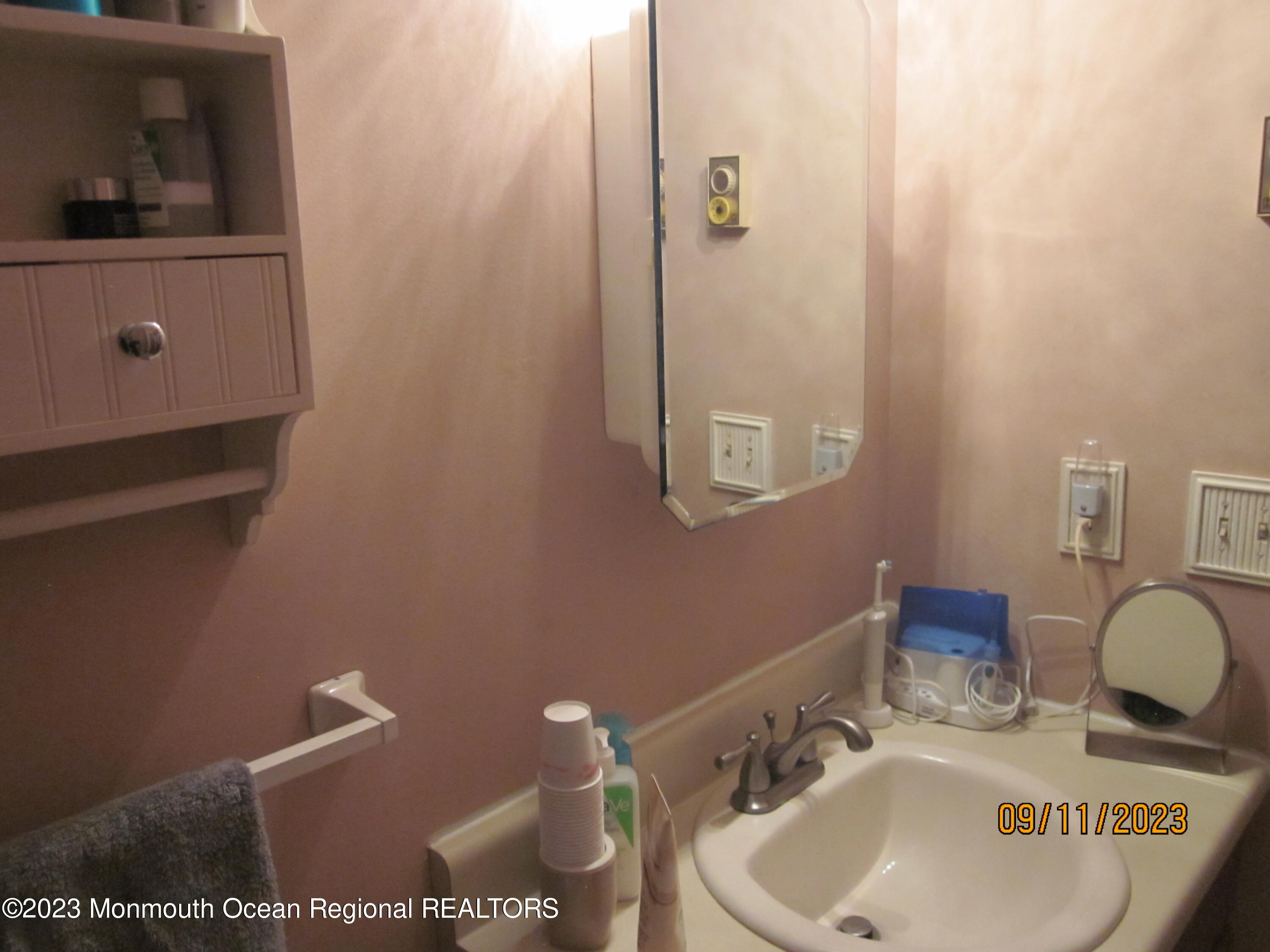 53 B Berkshire Road Whiting, NJ 08759 - Photo 25 of 37 a bathroom with a sink and a mirror