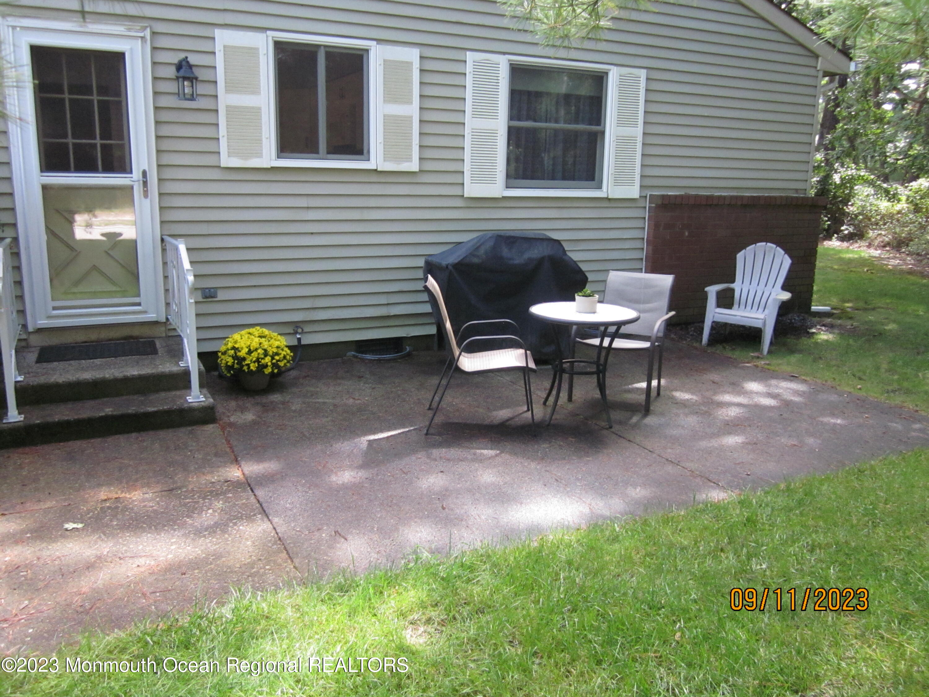 53 B Berkshire Road Whiting, NJ 08759 - Photo 37 of 37 a backyard of a house with table and chairs