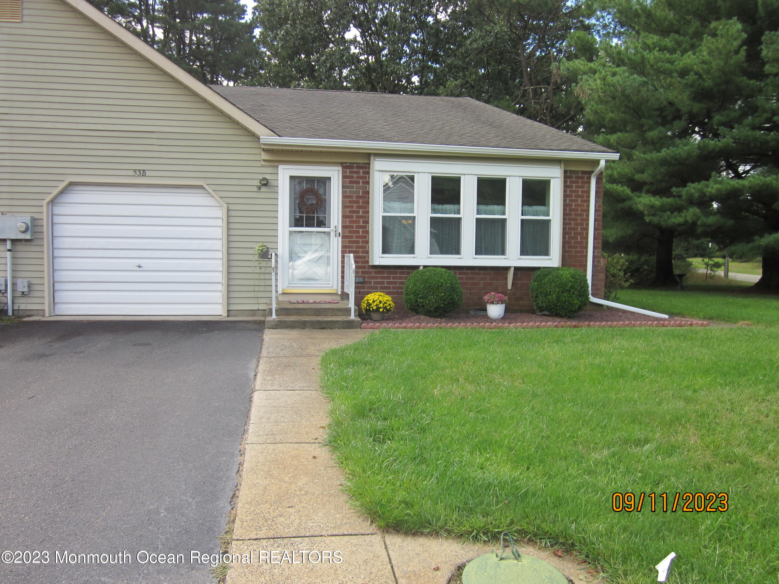 53 B Berkshire Road Whiting, NJ 08759 - Photo 4 of 37 a front view of a house with a garden