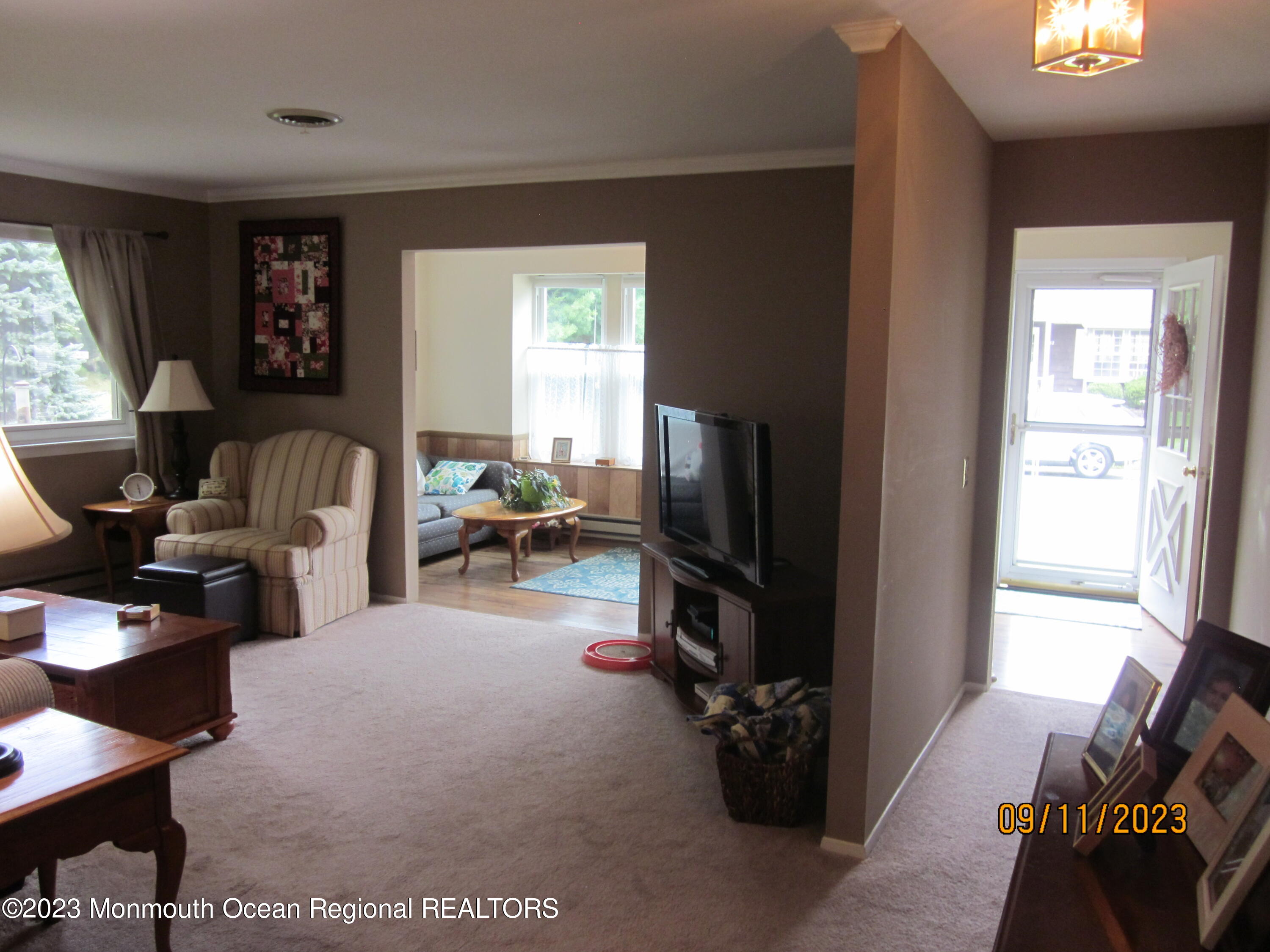 53 B Berkshire Road Whiting, NJ 08759 - Photo 7 of 37 a living room with furniture a window and a flat screen tv