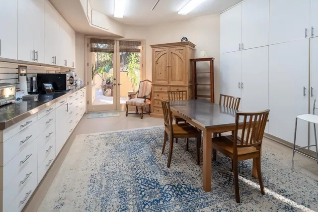 a house with palm tree in front of it