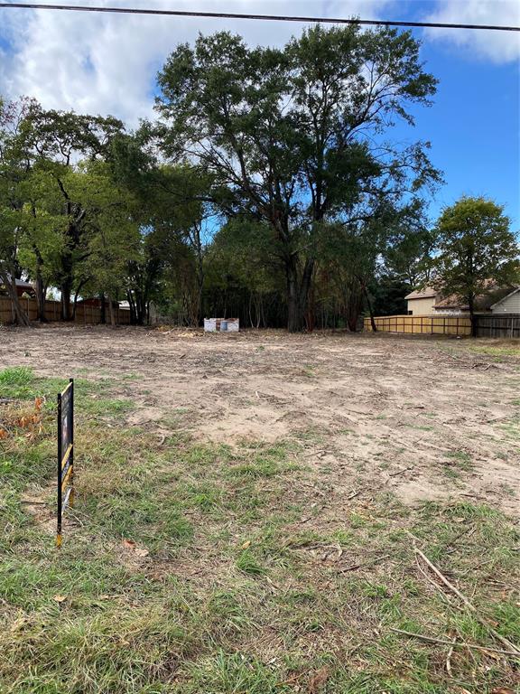178 Patton Lane Tyler, TX 75704 - Photo 4 of 8 a wooden bench sitting in the middle of a yard