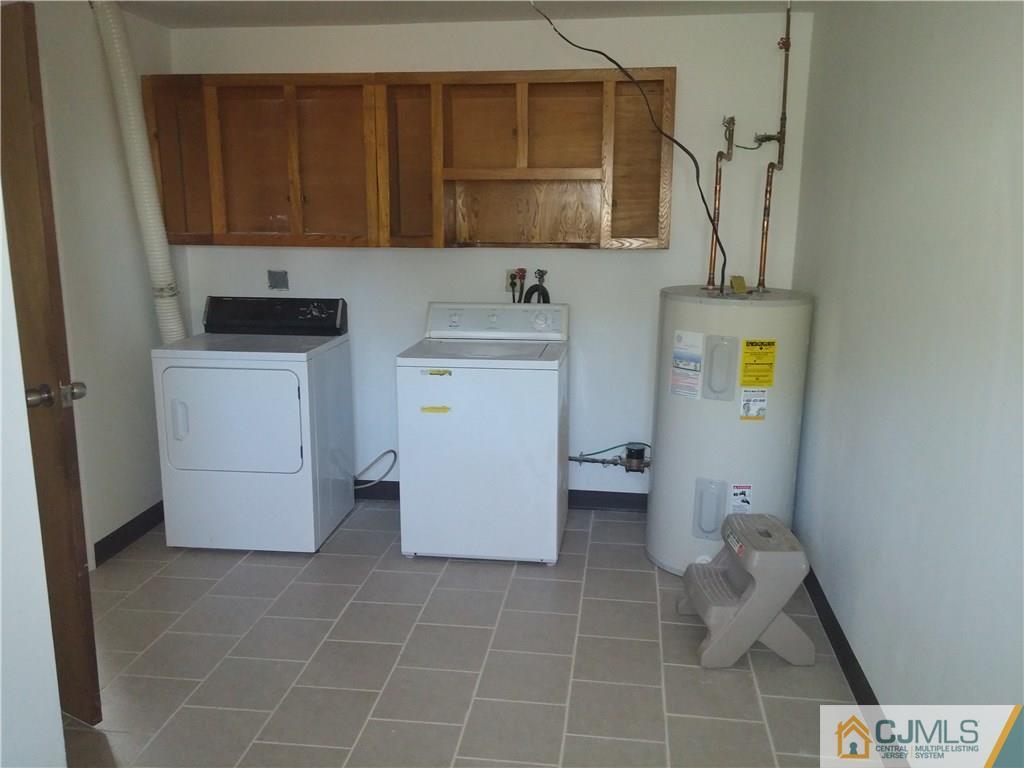 63 Enfield Road Colonia, NJ 07067 - Photo 12 of 17 a bathroom with a sink toilet and a mirror