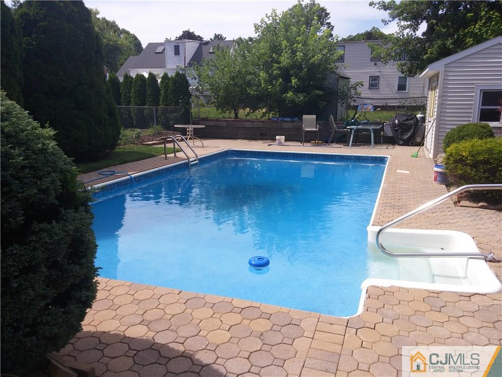 63 Enfield Road Colonia, NJ 07067 - Photo 15 of 17 a view of a backyard with sitting area