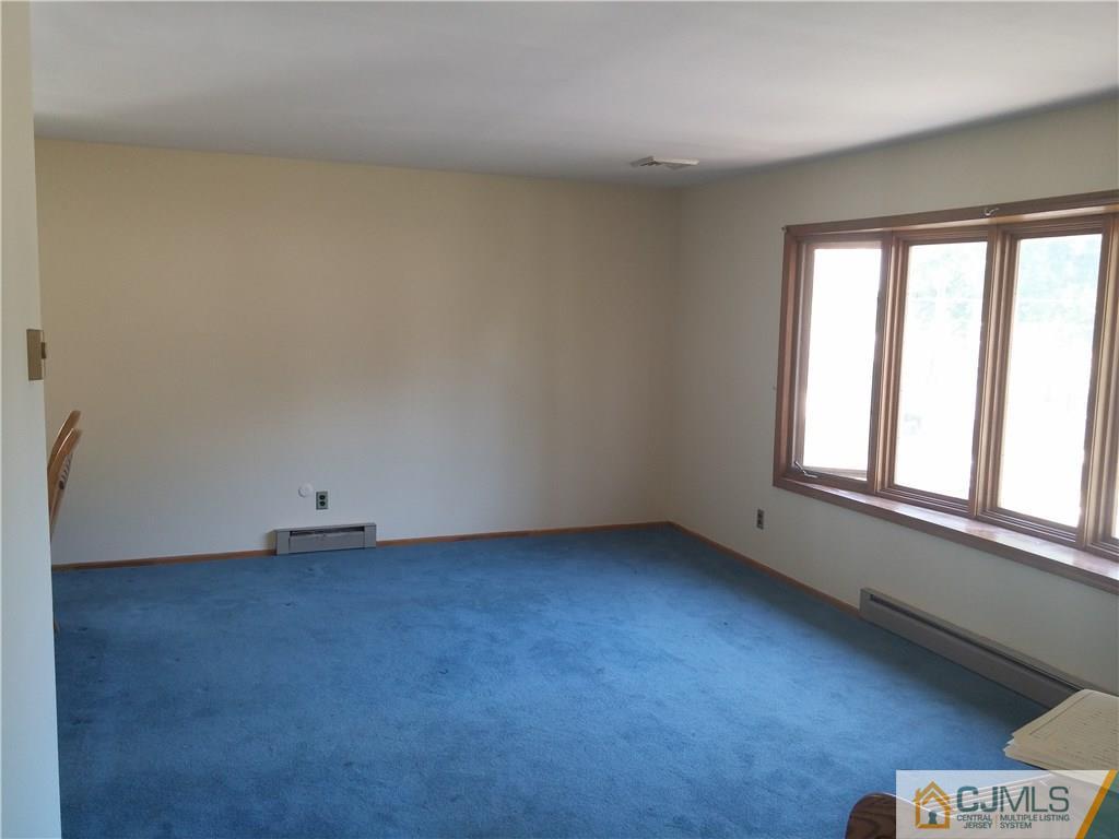 63 Enfield Road Colonia, NJ 07067 - Photo 3 of 17 an empty room with a window