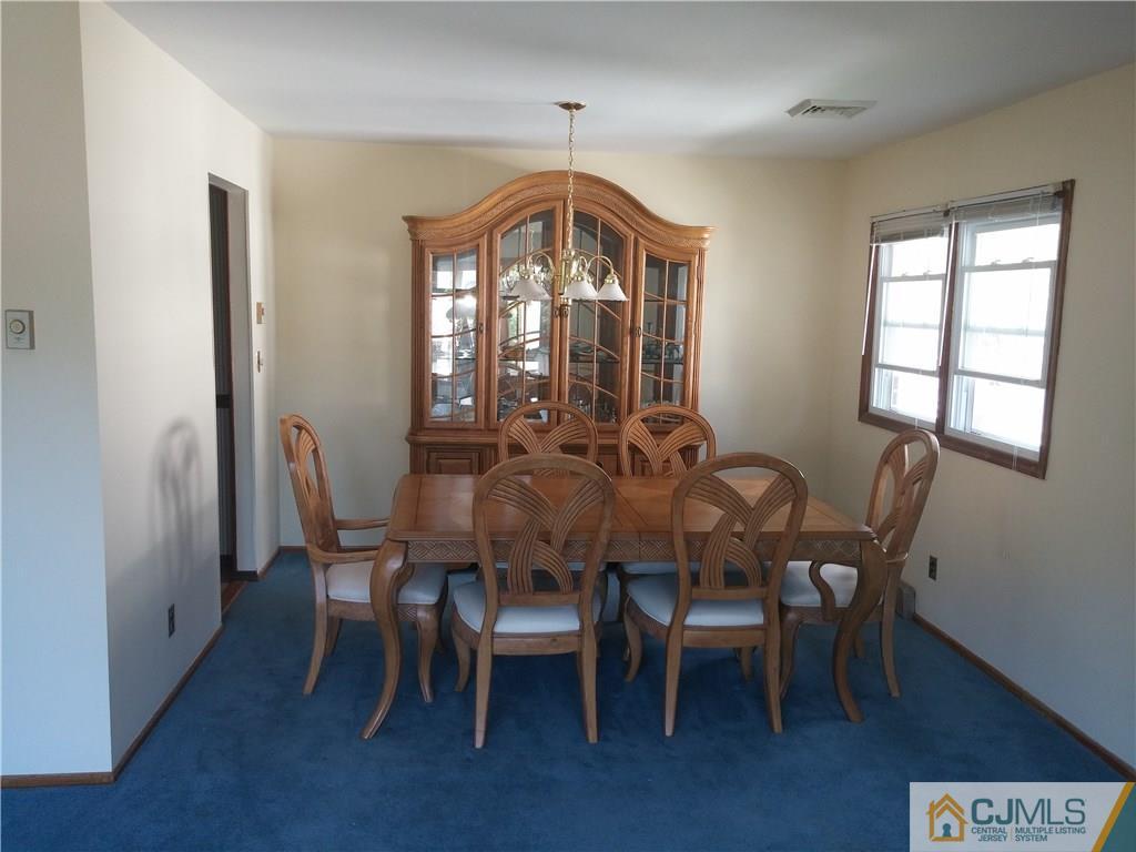 63 Enfield Road Colonia, NJ 07067 - Photo 4 of 17 a view of a dining room with furniture and window