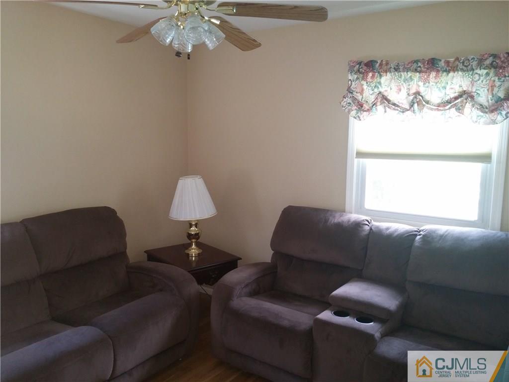 63 Enfield Road Colonia, NJ 07067 - Photo 7 of 17 a living room with furniture and a window