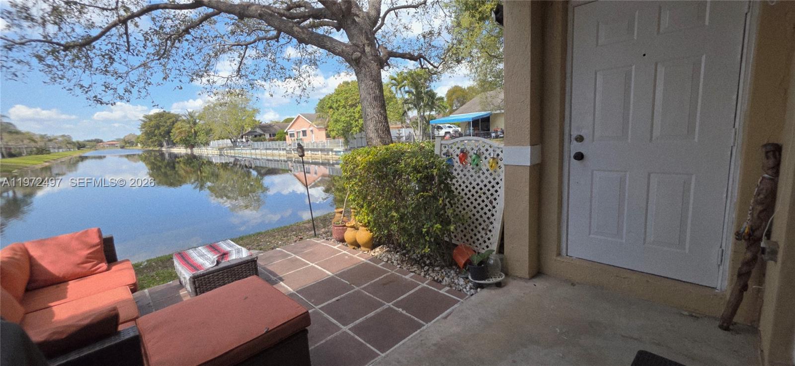 5937 Riverside Avenue Tamarac, FL 33321 - Photo 13 of 31 a backyard of a house with outdoor seating