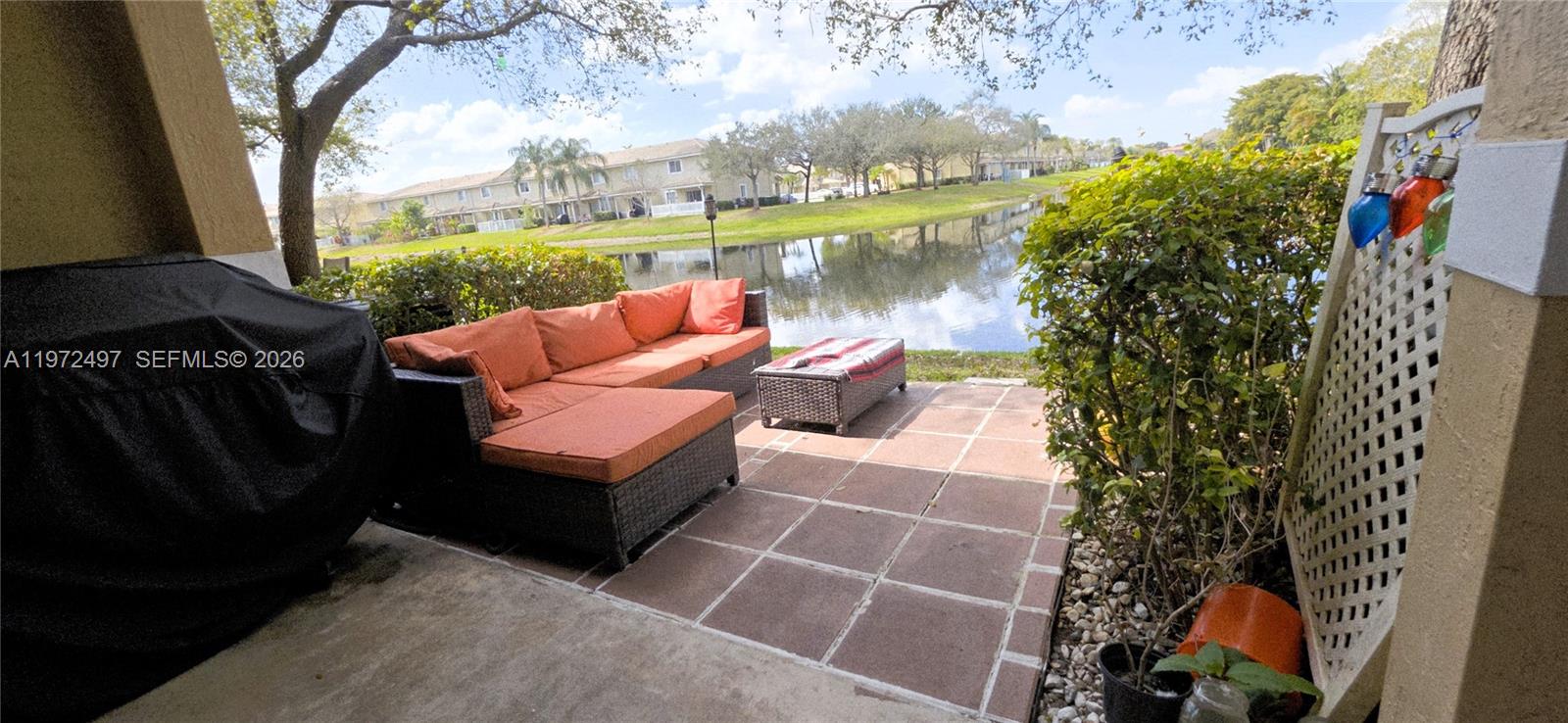 5937 Riverside Avenue Tamarac, FL 33321 - Photo 14 of 31 a view of a couches in a patio with a yard