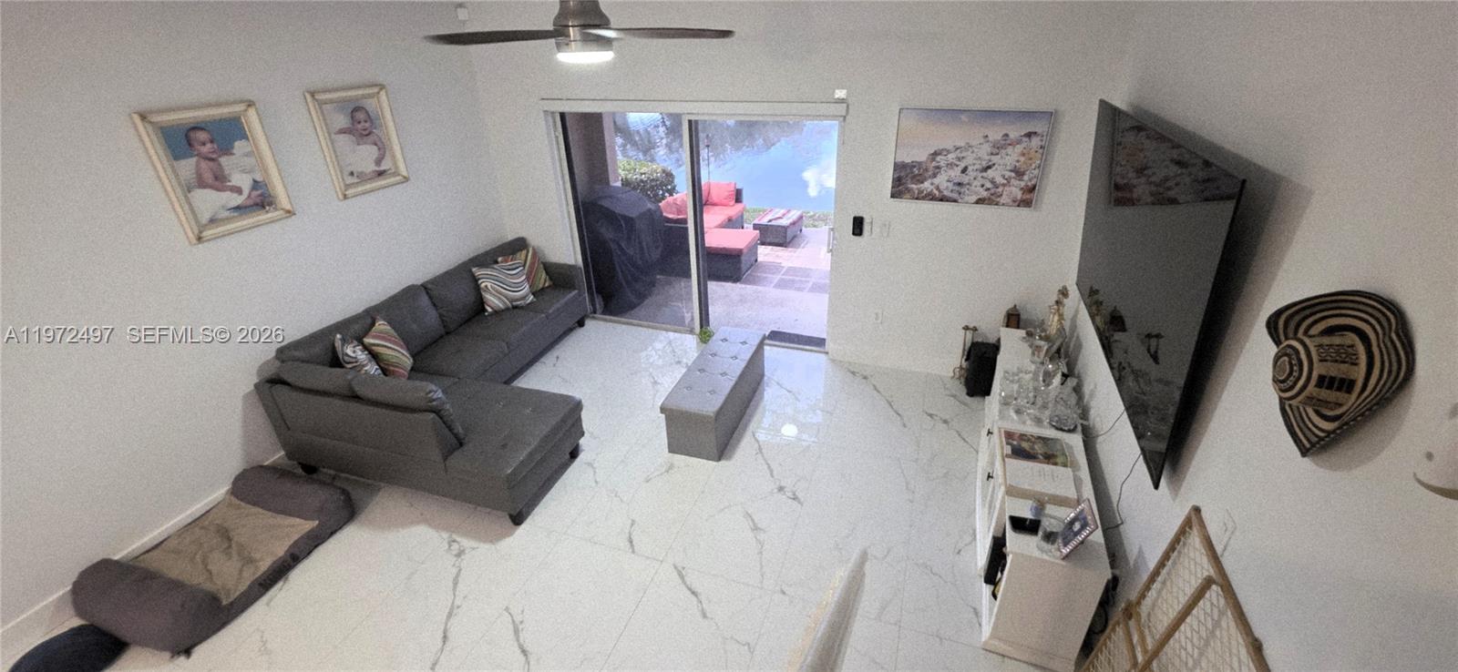 5937 Riverside Avenue Tamarac, FL 33321 - Photo 16 of 31 a view of a livingroom with furniture and entryway