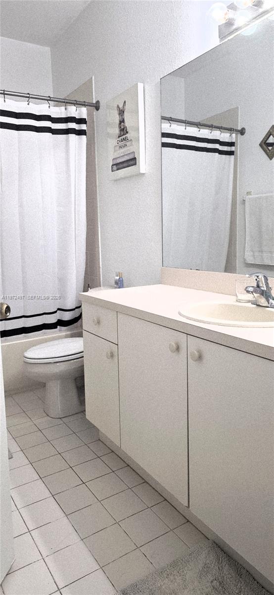 5937 Riverside Avenue Tamarac, FL 33321 - Photo 24 of 31 a utility room with cabinets washer and dryer