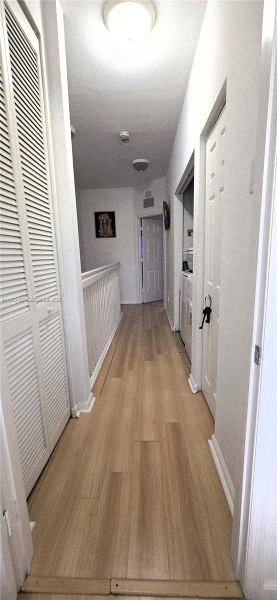 5937 Riverside Avenue Tamarac, FL 33321 - Photo 26 of 31 a view of empty room with wooden floor