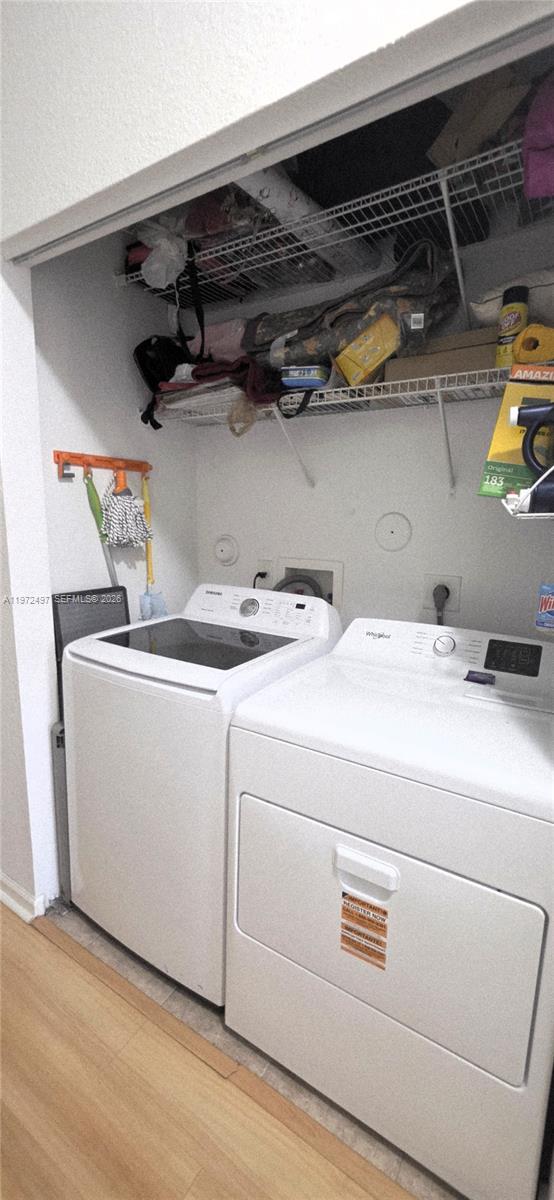 5937 Riverside Avenue Tamarac, FL 33321 - Photo 27 of 31 a utility room with dryer and washer