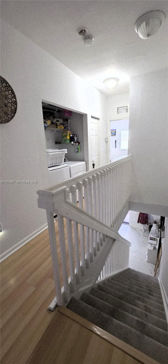 5937 Riverside Avenue Tamarac, FL 33321 - Photo 28 of 31 a bedroom with a bed and a window