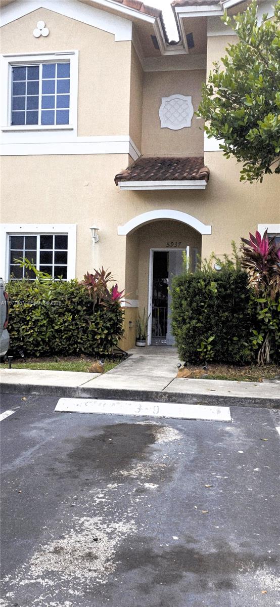 5937 Riverside Avenue Tamarac, FL 33321 - Photo 29 of 31 front view of a house with a yard