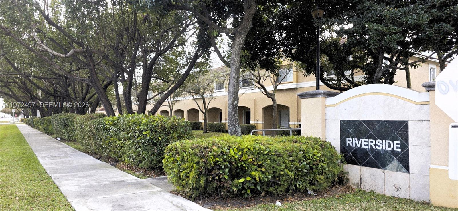 5937 Riverside Avenue Tamarac, FL 33321 - Photo 31 of 31 a front view of a house with a yard