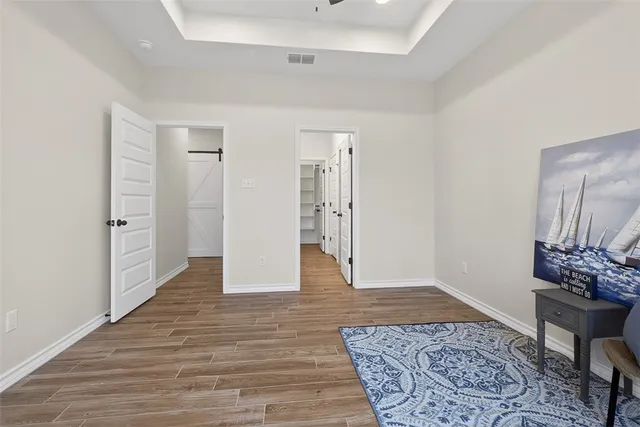 a bathroom with a granite countertop sink mirror and shower