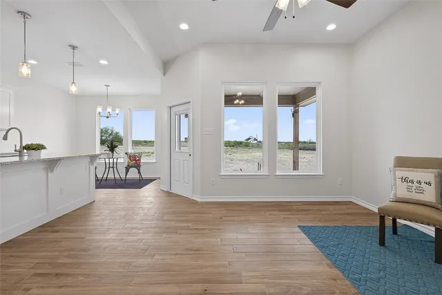 a view of a kitchen with furniture and a potted plant